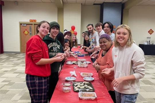 Students making Chinese dumplings.