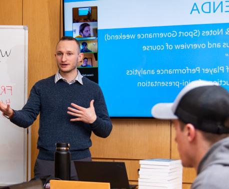 Prof. Carter Rockhill teaching a sports management course.